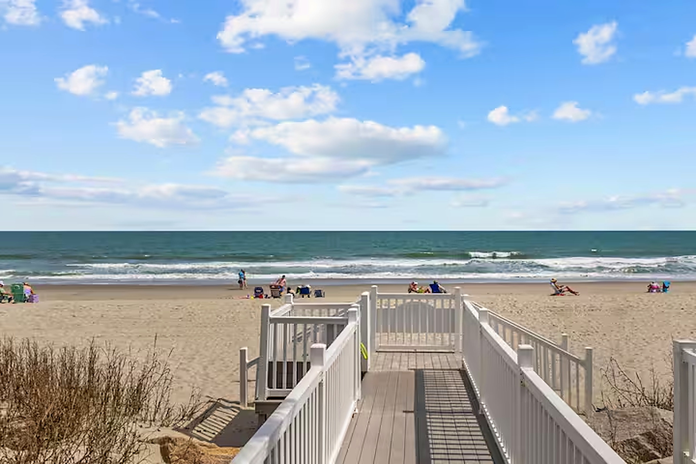 Private boardwalk over the dunes with direct access to the sand at Garden City Beach